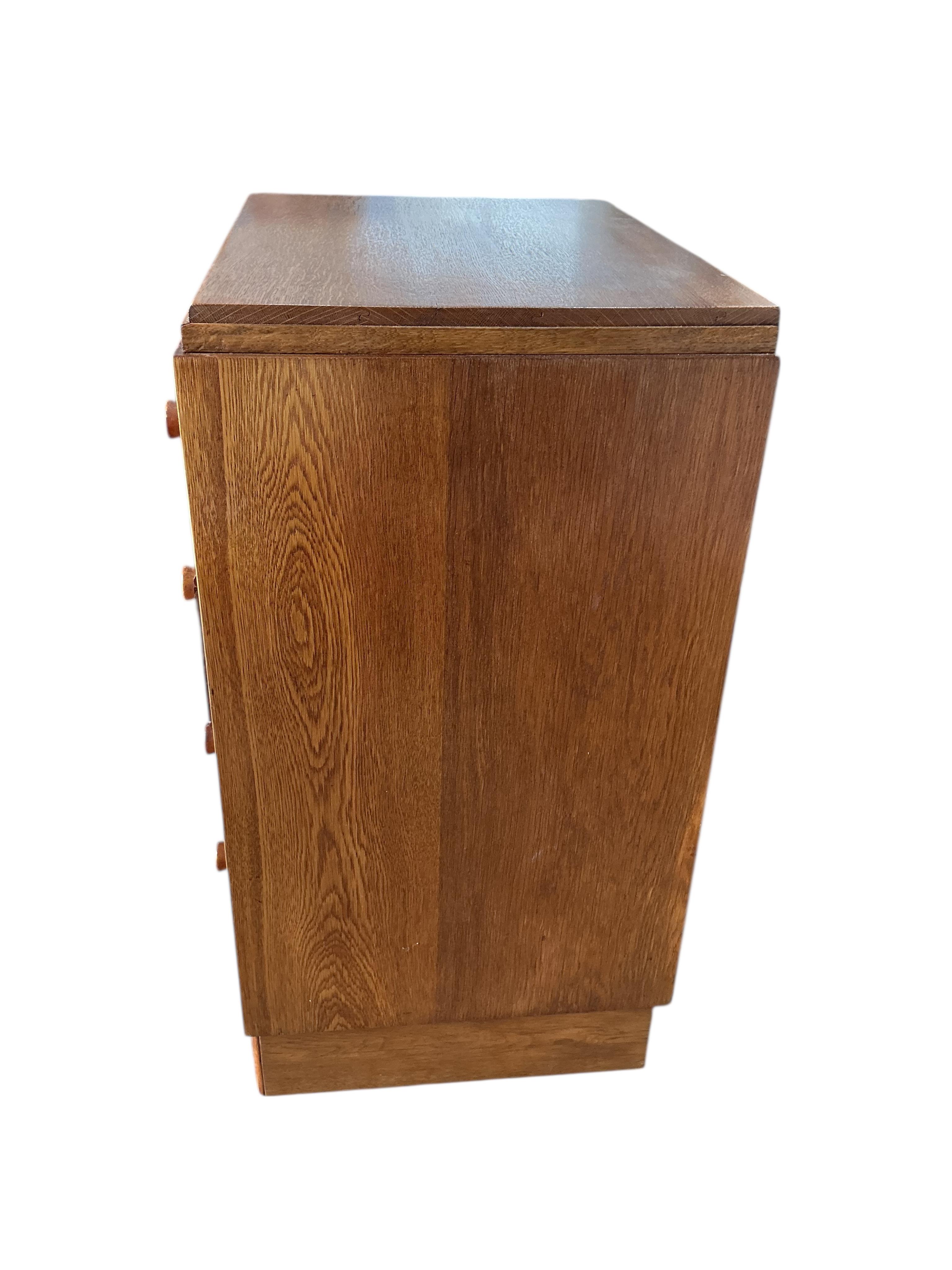 A small early 20th century oak chest of four drawers, width 61cm, depth 44cm, height 83cm